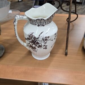 Two's Company one-quart cream and brown floral transferware pitcher.